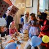Alice In wonderland with the birthday girl blowing out her candles