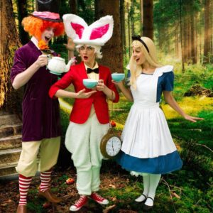 Alice, The Mad Hatter and the white Rabbit all enjoying tea